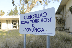 Edgar Heap of Birds (Cheyenne-Arapaho), Native Hosts, Claremont, California, 2013. Contemporary artist Edgar Heap of Birds created twenty sign panels recognizing sites and landmarks in the Los Angeles basin in the indigenous Tongva language. Povu’nga is the Tongva word for Long Beach. Photo: Scott Phillips. Artwork © Edgar Heap of Birds.